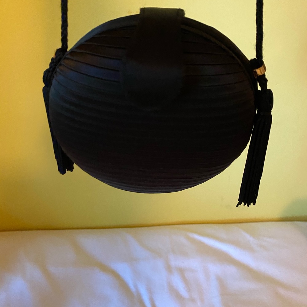 Purse with tassels on both sides
